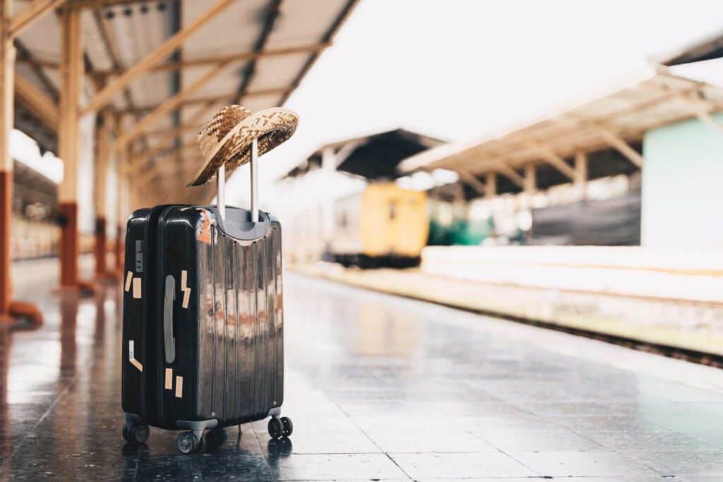 Summer Travel Concept Luggage With Straw Hat On 2026 03 16 22 59 29 Utc 1024x683
